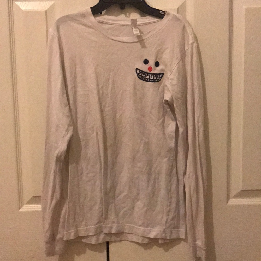 White long sleeve with a design